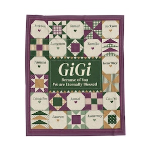 May include: A rectangular quilt featuring a patchwork design in shades of purple, green, and cream. The center panel displays the text "GiGi Because of You We are Eternally Blessed." Surrounding squares include names like Jackson, Jamal, and Tamika.
