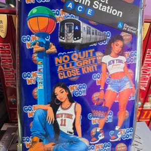 May include: A rectangular phone case with a blue background featuring New York City themes. It displays a subway train, a 34 Street Penn Station sign, two figures in casual clothing, a blue lamp post, and the text GO NY GO, NO QUIT ALL GRIT CLOSE KNIT.