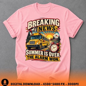 May include: A light pink t-shirt featuring a graphic print of a yellow school bus on a road with a sunrise background. The text reads BREAKING NEWS: SUMMER IS OVER. THE ALARM WON. A red alarm clock is positioned next to the bus illustration.