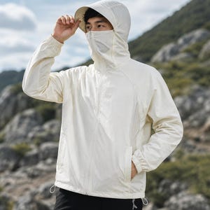 May include: A lightweight, off-white long-sleeve jacket featuring a full-length front zipper, a hood with a built-in face covering that zips up to the nose, and elasticized cuffs. The jacket includes a drawstring hem and two side pockets.