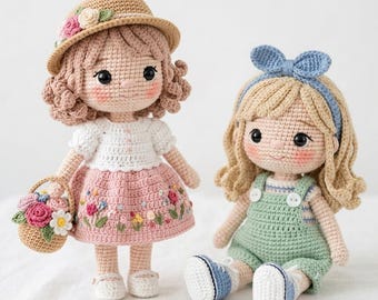May include: Two handmade crochet dolls. One doll wears a straw hat with floral accents, a white top, and a pink skirt with embroidered flowers. The other doll wears a green romper with a blue bow headband and blue shoes.