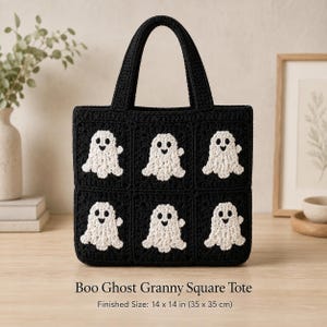 May include: A black crochet tote bag featuring six granny squares, each decorated with a white ghost motif. The bag has two sturdy handles and measures 14 by 14 inches. The text Boo Ghost Granny Square Tote is printed below the bag.