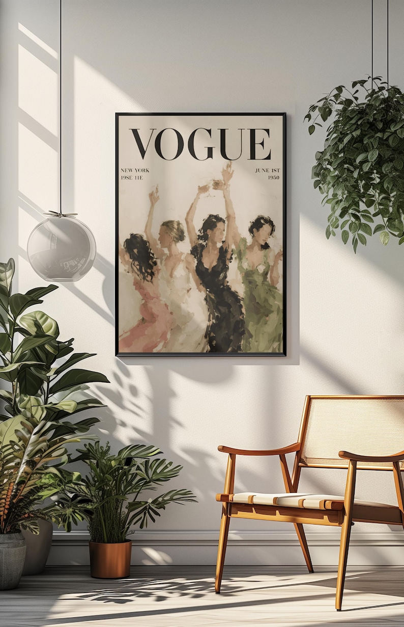 May include: A framed Vogue magazine cover print featuring a group of women in elegant dresses, dancing with raised arms. The print has a vintage aesthetic, with the Vogue logo at the top and the date "June 1st 1950". The color palette includes soft pinks, greens, and blacks.
