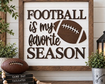 May include: A square wooden sign with a white shiplap background and a dark brown frame. The sign features dark brown 3D lettering that reads "FOOTBALL is my favorite SEASON" with a dark brown football icon replacing the letter O in football.