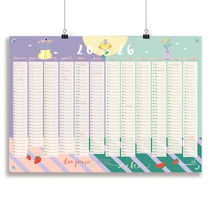 Op de afbeelding: Een kleurrijke 2016 kalenderposter met maanden in meerdere talen. Het ontwerp heeft pastelkleuren, bloemenillustraties en de tekst "bonjours bises". De kalender wordt vastgehouden door twee zwarte clips.