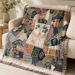 May include: A patchwork throw blanket with a variety of patterned fabric squares in shades of green, blue, pink, and orange. The blanket has a cream-colored border with a fringe and is draped over a beige sofa. The blanket's design includes floral and geometric patterns.