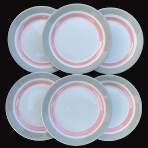 May include: Set of six white ceramic dinner plates with a gray and pink striped border.