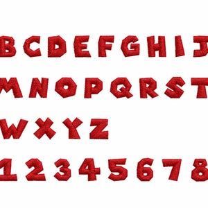 May include: A complete set of red embroidered alphabet letters from A to Z and numbers from 0 to 9. Each character features a bold, block-style font with a visible stitched texture, presented in a uniform red thread color against a plain background.