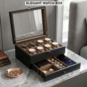 May include: Black wooden watch box with a glass top, displaying several watches with leather straps. The box has a drawer with compartments for jewelry and sunglasses. The text "ELEGANT WATCH BOX" is at the top.
