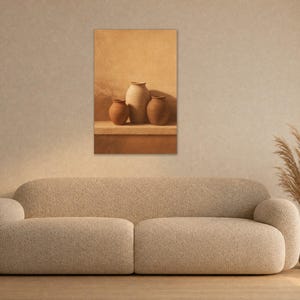May include: A rectangular wall art print featuring three tan ceramic vases of varying sizes arranged on a ledge. The artwork displays a monochromatic warm beige and brown color palette, capturing a still life composition of rounded pottery vessels.