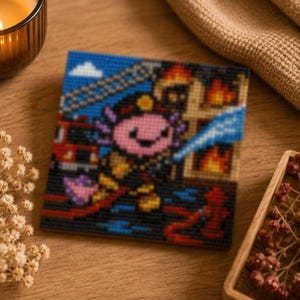 May include: Square cross-stitch art featuring a pink axolotl in a firefighter uniform, with a fire truck and flames in the background. The axolotl is holding a hose, with a blue sky and white clouds above. The artwork is on a wooden surface.