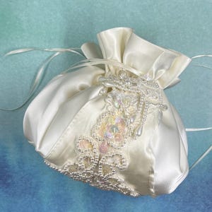 Consultation: jewelry bag made from your mother's wedding dress, a vintage bridal gown repurposing project.  Let’s talk about it.