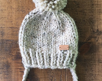 heathered oatmeal toddler size chunky knit hat with pompom and ties