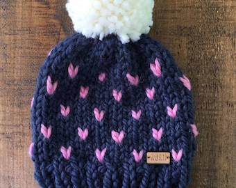 navy blue and pink chunky knit toddler size Marble Mountain hat with white pompom