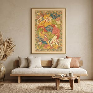 May include: A framed artwork with a colorful floral design hangs above a wooden sofa with neutral-colored cushions. The artwork features a vibrant mix of red, yellow, green, and blue hues. A vase with dried plants and a small wooden table complete the room's decor.