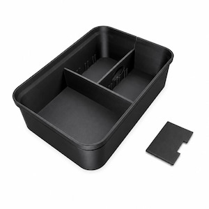 May include: A rectangular black plastic storage tray featuring three internal compartments separated by two removable dividers. The tray has a smooth matte finish and includes one additional small rectangular black divider piece placed outside the main container.