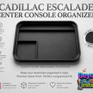 May include: Black center console organizer for Cadillac Escalade. Features a custom fit for 2021-2026 models. Made of durable PETG material, it maximizes storage and includes a non-slip liner. The text on the image says "Keep your essentials organized in style."