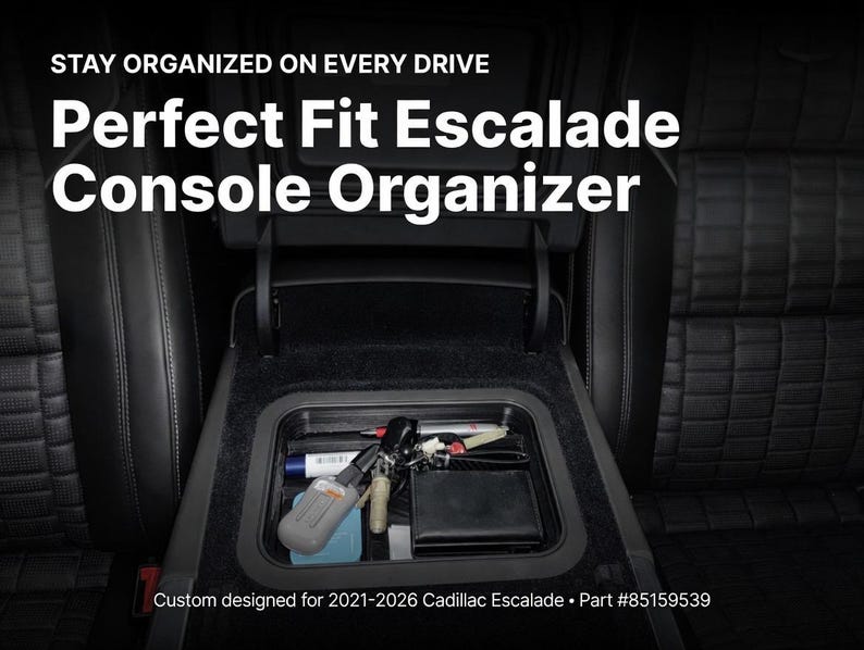 Op de afbeelding: Een zwarte console-organizer voor een Cadillac Escalade, gevuld met items zoals sleutels, een portemonnee en pennen. De tekst luidt "Perfect Fit Escalade Console Organizer" en "Stay Organized on Every Drive."