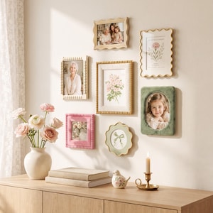 May include: A gallery wall arrangement featuring seven assorted picture frames in various shapes, colors, and textures, including beaded, scalloped, and velvet finishes, displaying photographs and botanical prints alongside a white vase with pink flowers.