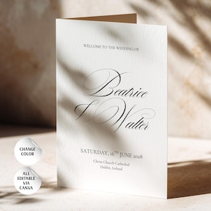 Könnte beinhalten: Eine gefaltete weiße Hochzeitseinladungskarte mit schwarzem Text, der WELCOME TO THE WEDDING OF Beatrice & Walter SATURDAY, 16TH JUNE 2028 Christ Church Cathedral Dublin, Ireland lautet. Zwei weiße runde Symbole zeigen CHANGE COLOR und ALL EDITABLE VIA CANVA.