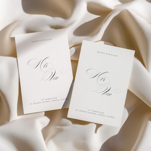 May include: Two off-white rectangular vow cards with black text. One card reads His Vow, the other Her Vow. Both feature the names Brenda & William, the date 16th March 2028, and the location St. Peter's Church, Vienna, Austria in elegant typography.
