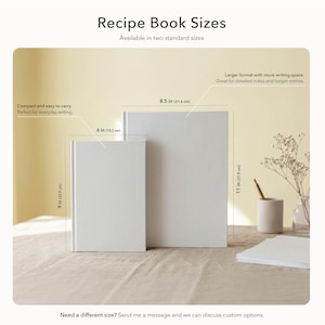 May include: Two white recipe books of different sizes are displayed. The smaller book is 6 inches (15.2 cm) wide and 9 inches (22.9 cm) tall. The larger book is 8.5 inches (21.6 cm) wide and 11 inches (27.9 cm) tall. Text on the image reads "Recipe Book Sizes."
