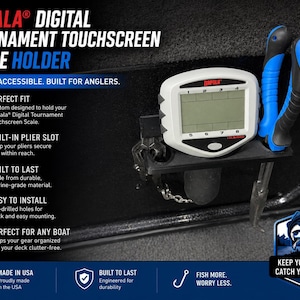 May include: A Rapala Digital Tournament Touchscreen Scale Holder, designed for anglers. The holder features a white and black digital scale with a built-in plier slot and blue and black pliers. The text on the holder says "Secure. Accessible. Built for Anglers."