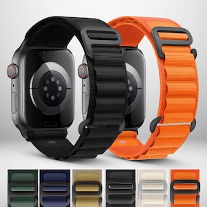May include: Two smartwatches with black and orange bands are displayed. The black band is on the left, and the orange band is on the right. Below are additional bands in green, blue, tan, black, white, and orange.