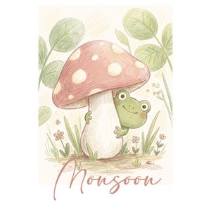 May include: A colored pencil illustration featuring a small green frog peeking from behind a large mushroom with a pink cap and white spots. The scene includes green leaves, small flowers, and the word Monsoon written in cursive script below.
