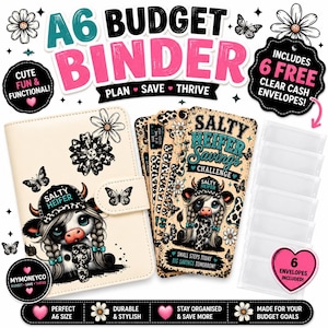 May include: A6 budget binder in cream, featuring a cow graphic, butterflies, and the text "SALTY HEIFER Savings CHALLENGE." Includes clear cash envelopes. The binder is labelled "Cute & Functional!" and "Durable & Stylish."