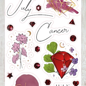 May include: A set of July Cancer themed stickers featuring a red ruby gemstone, a pink flower, and the text "July Cancer" and "Ruby".