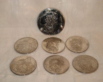 Juego de 7 posavasos de Papá Noel bañados en plata
