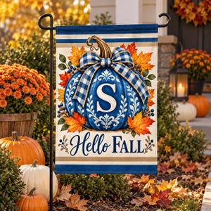 May include: A rectangular garden flag featuring a blue pumpkin with a white letter S, a blue and white checkered bow, and orange autumn leaves. The text Hello Fall is printed in dark blue script at the bottom, set against a cream background.