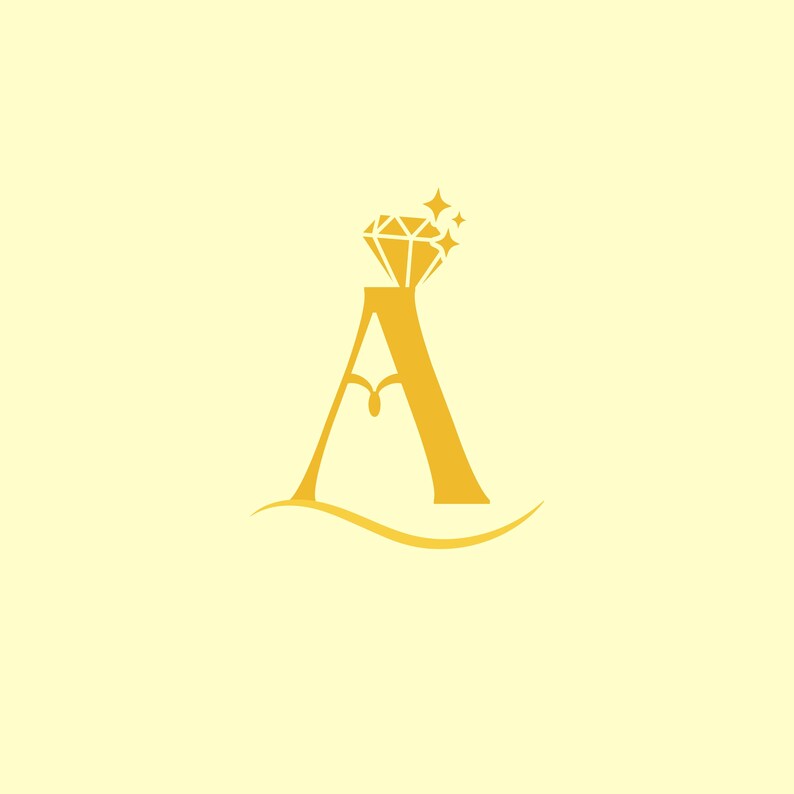 May include: A golden graphic logo featuring the capital letter A with a stylized diamond shape resting on its peak. The letter includes a decorative curved line at the base and small star-like accents surrounding the diamond on a pale yellow background.