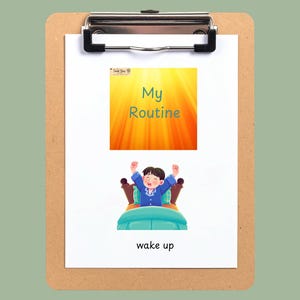 May include: A brown clipboard holding a white sheet of paper with the text MORNING ROUTINE CARDS - BOY ILLUSTRATIONS. The paper features a yellow My Routine graphic and an illustration of a child in blue pajamas waking up in bed.