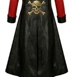 May include: A long black coat featuring bright red sleeves with black cuffs. The back of the coat displays a large, metallic gold-colored skull and crossbones emblem centered between the shoulder blades, with a vertical seam running down the center.