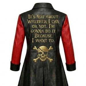 May include: A black long-sleeved jacket with red sleeves and black cuffs. The back features a gold-colored skull and crossbones graphic above the text: IT'S NOT ABOUT WHETHER I CAN OR NOT. I'M GONNA DO IT BECAUSE I WANT TO.