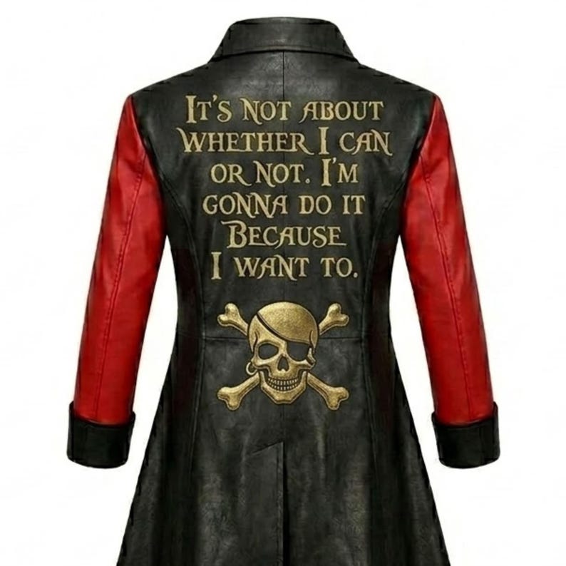 May include: A black long-sleeved jacket with red sleeves and black cuffs. The back features a gold-colored skull and crossbones graphic above the text: IT'S NOT ABOUT WHETHER I CAN OR NOT. I'M GONNA DO IT BECAUSE I WANT TO.