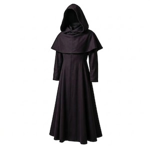 May include: A floor-length, dark purple hooded cloak featuring long sleeves and a structured shoulder capelet. The garment is crafted from a solid-coloured fabric and includes a deep, pointed hood that drapes over the shoulders and upper torso.