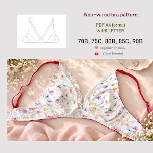 Puede incluir: Patrón de sujetador sin aros en formato PDF A4 y US Letter para tallas 70B, 75C, 80B, 85C, 90B. La imagen muestra un sujetador blanco con estampado floral colorido, tirantes rojos ajustables y un borde de encaje blanco en el escote.