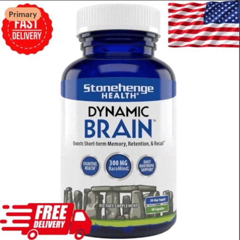 May include: A blue bottle of Stonehenge Health Dynamic Brain dietary supplement. The label includes the text "Boosts Short-term Memory, Retention, & Recall". The bottle also has the text "300 MG BacoMind" and "Daily Nootropic Support". An American flag is in the background.
