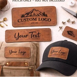 May include: Rectangular brown faux leather patches with laser-engraved designs including mountains, custom logos, and text. The patches are displayed alongside a tan backpack and a black baseball cap, showing application options for sewing or gluing.