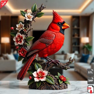 May include: A vibrant red cardinal bird sculpture perched on a branch with white and red flowers and green leaves. The bird has a black mask and orange beak. The sculpture is on a marble surface.