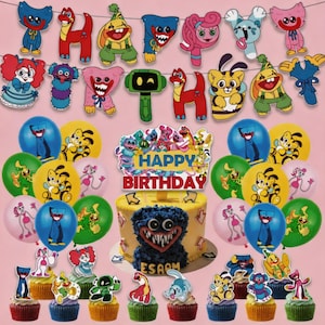 May include: A colorful birthday party set featuring a cake, cupcakes, balloons, and a banner. The cake is decorated with a blue monster face. The banner spells "HAPPY BIRTHDAY" with cartoon characters. Balloons are blue, yellow, and pink.