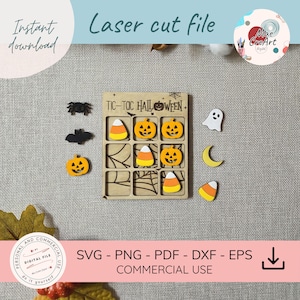 May include: A laser-cut wooden tic-tac-toe board with the text TIC-TOC HALLOWEEN, featuring a spiderweb design. The set includes small wooden game pieces shaped like black spiders, black bats, orange jack-o'-lanterns, candy corn, a white ghost, and a yellow crescent moon.