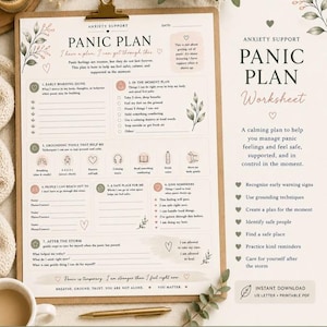 Peut inclure: Une fiche de travail imprimée intitulée Anxiety Support Panic Plan sur un presse-papier avec une pince dorée. Le document comporte des sections pour les signes avant-coureurs, les outils d'ancrage et des rappels, ornés d'illustrations botaniques.