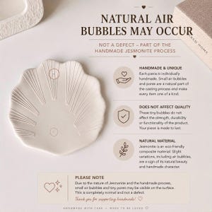 May include: A cream-coloured, shell-shaped Jesmonite tray with embossed radial lines. Text on the image explains that natural air bubbles may occur during the handmade process, noting that these small pores are not defects but part of the material.