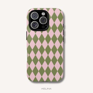 May include: A smartphone case featuring a repeating diamond argyle pattern in alternating shades of light pink and olive green. The case has a cutout for a triple-lens camera system on the upper left side and the word KELINA printed at the bottom.