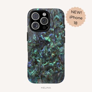 May include: A smartphone case featuring an iridescent abalone shell pattern with deep blue, green, and purple tones. The case has a black camera module cutout. A circular badge in the top right corner displays the text NEW! iPhone 18.
