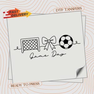 May include: A black and white line drawing of a soccer goal, bow, and soccer ball with the words "Game Day". The image is on a light gray background with the words "Fast Delivery" and "Ready to Press".